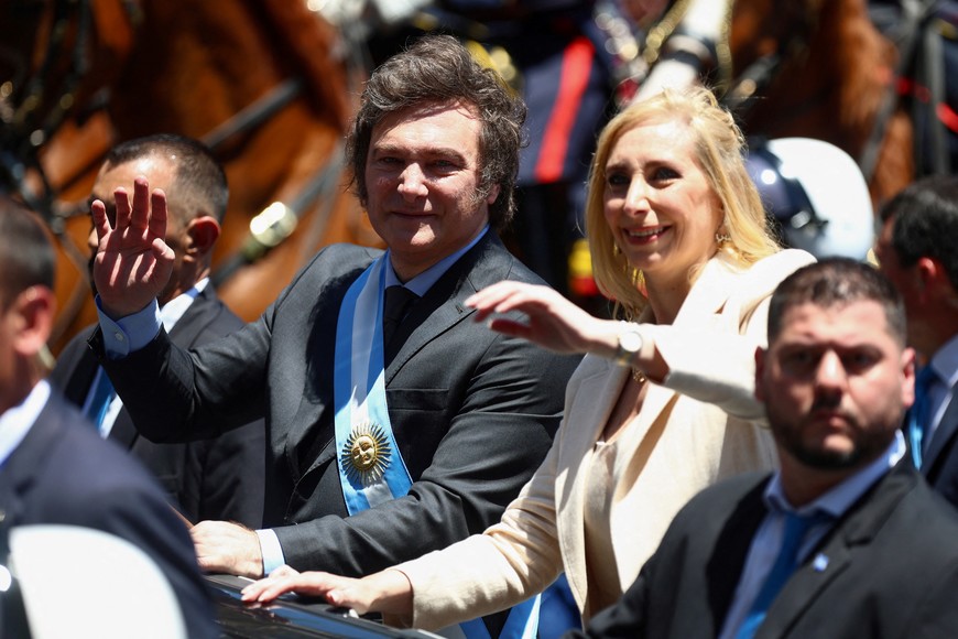 Argentina's President Javier Milei and his sister, Karina Milei, wave to supporters after the swearing-in ceremony, in Buenos Aires, Argentina December 10, 2023. REUTERS/Matias Baglietto