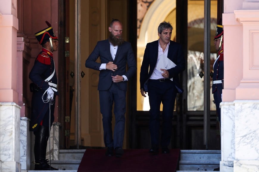 Argentina's Minister of Economy Luis Caputo walks out from the Casa Rosada Presidential Palace, one day after the inauguration of Argentina's President Javier Milei, in Buenos Aires, Argentina, December 11, 2023. REUTERS/Agustin Marcarian