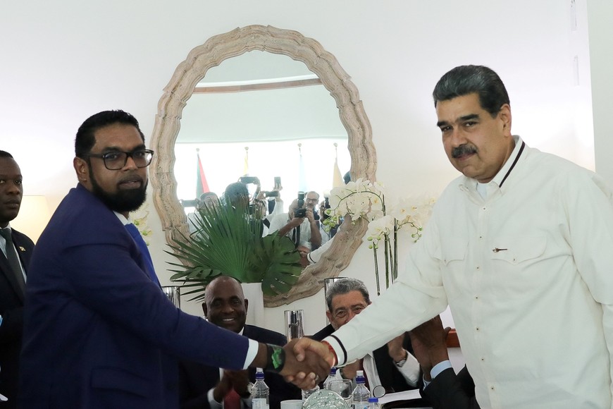 Venezuela's President Nicolas Maduro and Guyanese President Irfaan Ali shake hands as they meet amid tensions over a border dispute, in Kingstown, St. Vincent and the Grenadines December 14, 2023. Miraflores Palace/Handout via REUTERS ATTENTION EDITOR - THIS IMAGE HAS BEEN SUPPLIED BY A THIRD PARTY