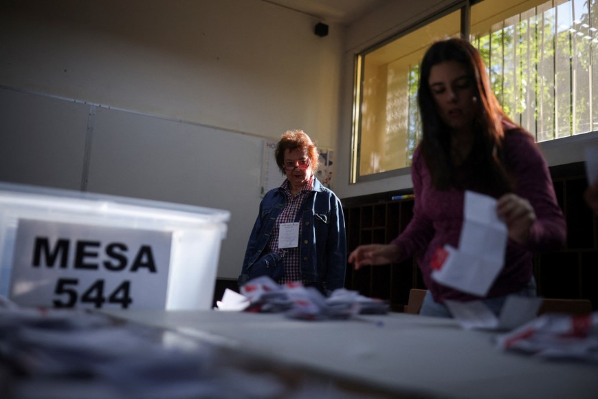 Election officials count ballots, after polls closed, during a referendum on a new Chilean constitution, in Santiago, Chile, December 17, 2023. REUTERS/Pablo Sanhueza