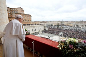 Pope Francis stands as he delivers his traditional Christmas Day Urbi et Orbi message to the city and the world from the main balcony of St. Peter's Basilica at the Vatican, December 25, 2023.   Vatican Media/Handout via REUTERS    ATTENTION EDITORS - THIS IMAGE WAS PROVIDED BY A THIRD PARTY.
