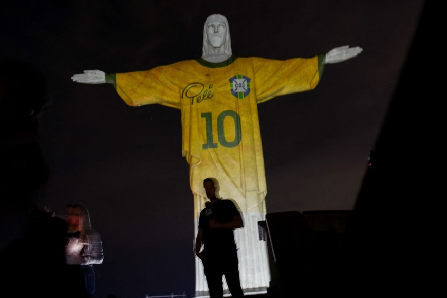An image is projected on the Christ the Redeemer statue in tribute to Brazilian soccer legend Pele's death anniversary, in Rio de Janeiro, Brazil December 29, 2023. REUTERS/Tita Barros NO RESALES. NO ARCHIVES
