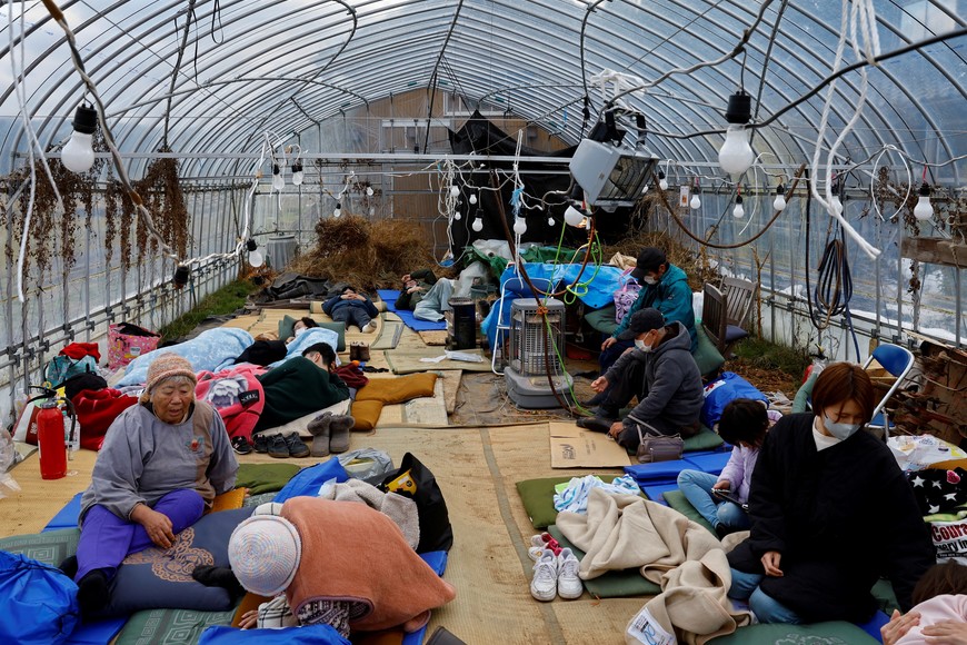 Evacuated people rest at a green house converted as an evacuation center, in the aftermath of an earthquake,  in Wajima, Ishikawa prefecture, Japan January 2, 2024, REUTERS/Kim Kyung-Hoon