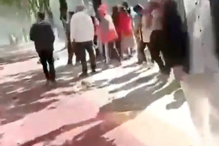 People gather following an explosion after artillery shells fell in Nansan, Yunnan Province, China, in this screengrab obtained from a social media video, released on January 3, 2024. Video Obtained By Reuters/via REUTERS  THIS IMAGE HAS BEEN SUPPLIED BY A THIRD PARTY. NO RESALES. NO ARCHIVES.