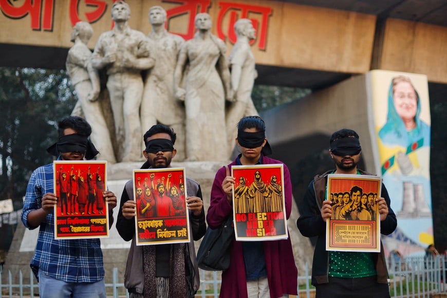 Students hold placards, as they protest demanding election under caretaker government, at the University of Dhaka, ahead of the general election in Dhaka, Bangladesh, January 5, 2024. REUTERS/Adnan Abidi