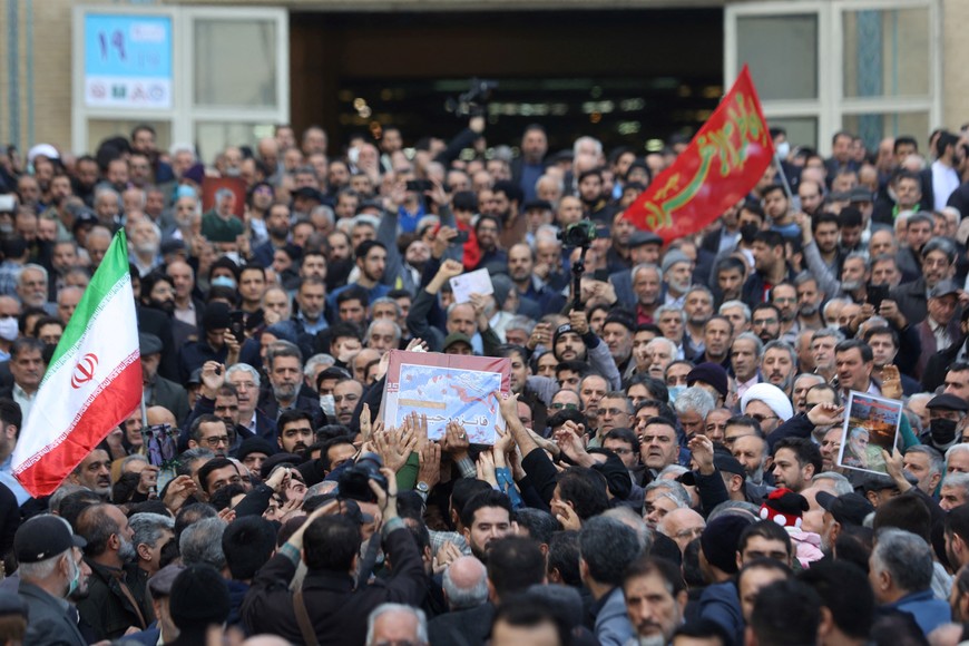 People carry the coffin of Faezeh Rahimi, one of the casualties of the Islamic State attack in Kerman, after Friday prayers in Tehran, Iran, January 5, 2024. Majid Asgaripour/WANA (West Asia News Agency) via REUTERS ATTENTION EDITORS - THIS PICTURE WAS PROVIDED BY A THIRD PARTY
