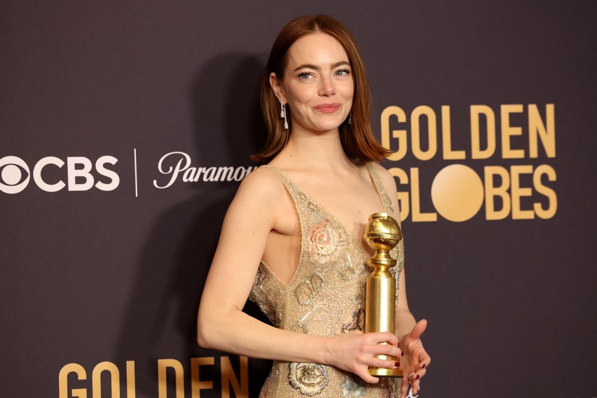 Emma Stone poses with the award for Best Performance by a Female Actor in a Motion Picture - Musical or Comedy for "Poor Things", at the 81st Annual Golden Globe Awards in Beverly Hills, California, U.S., January 7, 2024. REUTERS/Mario Anzuoni