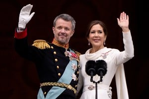 Denmark's newly proclaimed King Frederik and Queen Mary wave on the balcony of Christiansborg Palace, following the abdication of former Queen Margrethe who reigned for 52 years, in Copenhagen, Denmark, January 14, 2024. Ritzau Scanpix/Bo Amstrup via REUTERS ATTENTION EDITORS - THIS IMAGE WAS PROVIDED BY A THIRD PARTY. DENMARK OUT. NO COMMERCIAL OR EDITORIAL SALES IN DENMARK.