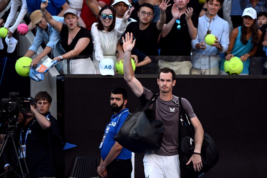 Tennis - Australian Open - Melbourne Park, Melbourne, Australia - January 15, 2024
Britain's Andy Murray waves to the crowd after losing his first round match against Argentina's Tomas Martin Etcheverry REUTERS/Tracey Nearmy     TPX IMAGES OF THE DAY
