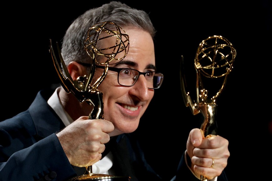 John Oliver poses with the Scripted Variety Series award and the Writing For A Variety Series award for "Last Week Tonight With John Oliver" at the 75th Primetime Emmy Awards in Los Angeles, California, U.S., January 15, 2024. REUTERS/Aude Guerrucci