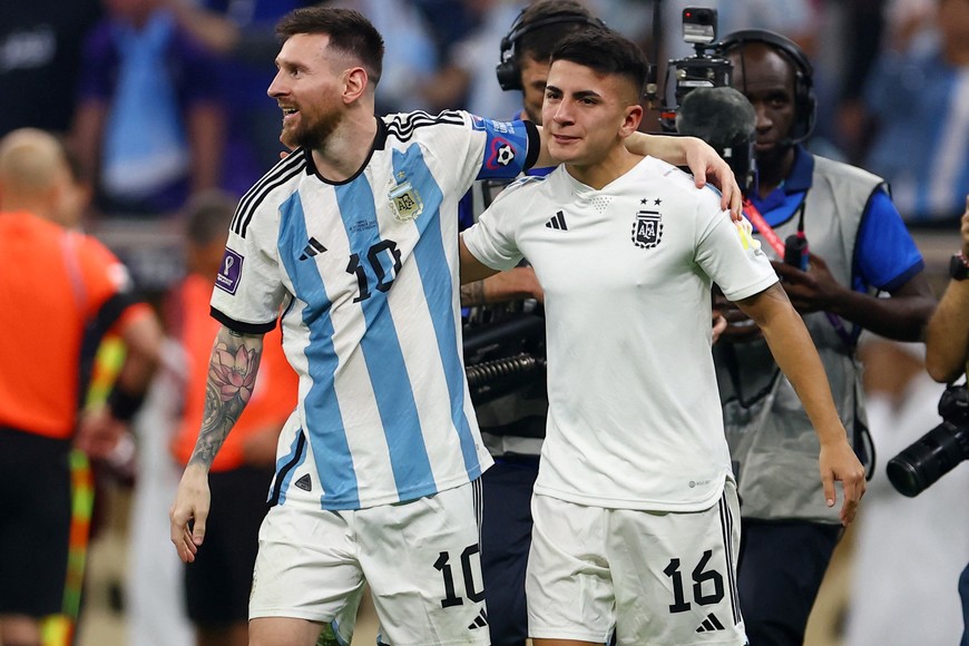 Soccer Football - FIFA World Cup Qatar 2022 - Final - Argentina v France - Lusail Stadium, Lusail, Qatar - December 18, 2022 
Argentina's Lionel Messi and Thiago Almada celebrate winning the World Cup REUTERS/Hannah Mckay