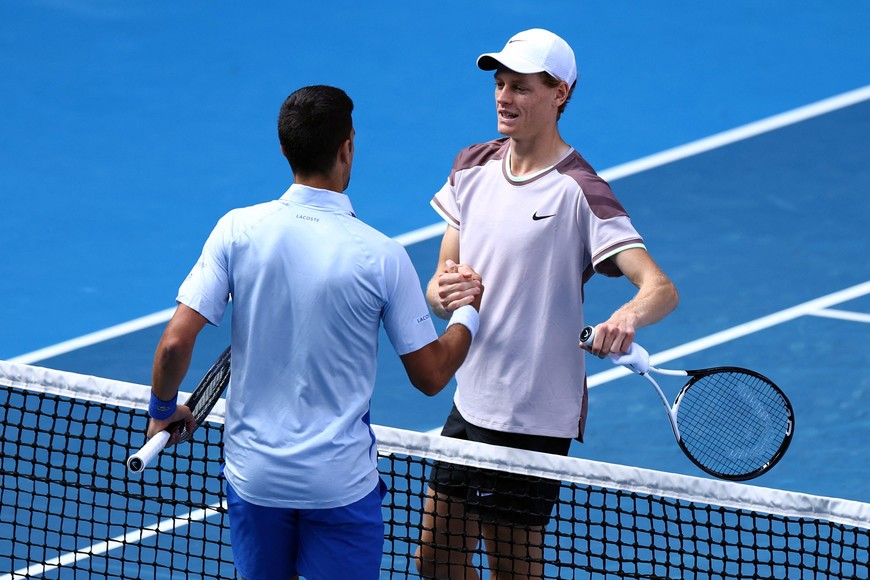 Tennis - Australian Open - Melbourne Park, Melbourne, Australia - January 26, 2024
Italy's Jannik Sinner shakes hands with Serbia's Novak Djokovic after winning his semi final match REUTERS/Edgar Su