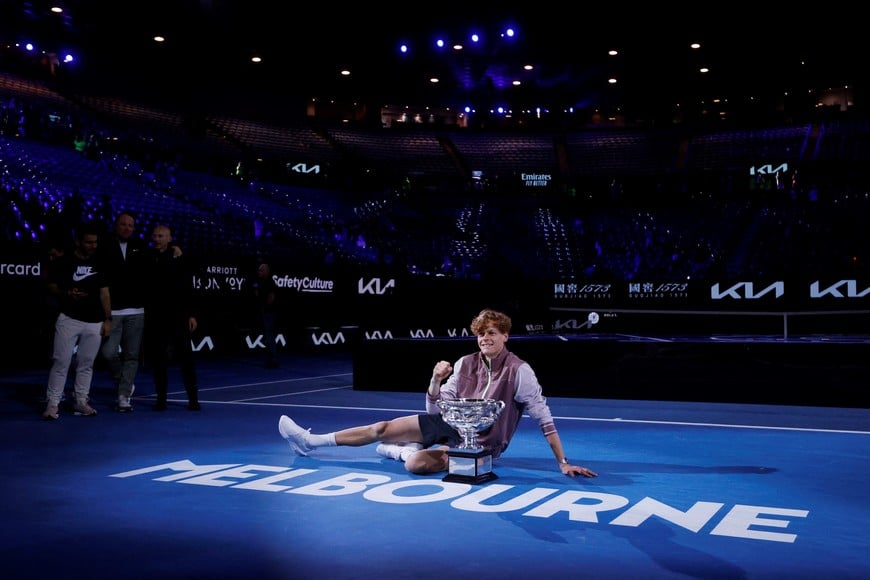 Tennis - Australian Open - Melbourne Park, Melbourne, Australia - January 28, 2024
Italy's Jannik Sinner poses for a picture with the trophy after winning the final against Russia's Daniil Medvedev REUTERS/Ciro De Luca