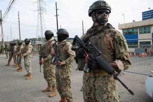 Soldiers stand outside the Zonal 8 prison, from where Jose Adolfo Macias alias "Fito" disappeared almost a week ago, after at least five inmates escaped, according to police reports, in Guayaquil, Ecuador, January 13, 2024. REUTERS/Henry Romero
