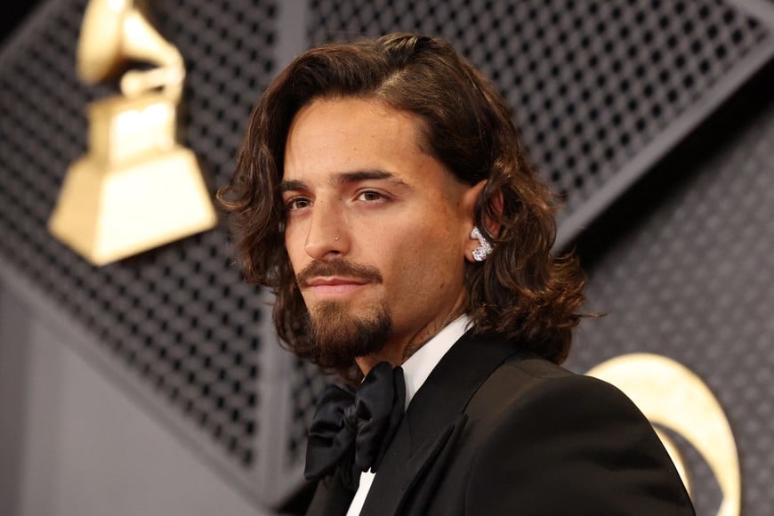 Maluma poses on the red carpet as he attends the 66th Annual Grammy Awards in Los Angeles, California, U.S., February 4, 2024. REUTERS/Mario Anzuoni