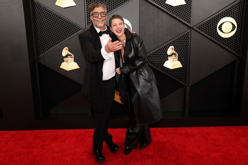 Fito Paez and Eugenia Kolodziej pose on the red carpet as they attend the 66th Annual Grammy Awards in Los Angeles, California, U.S., February 4, 2024. REUTERS/Mario Anzuoni