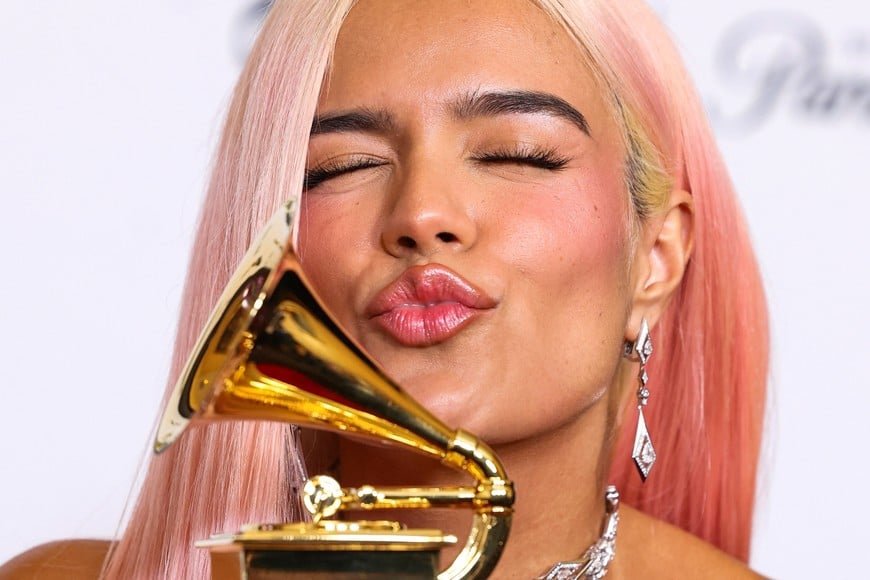 Karol G poses with the Best Musica Urbana Album award during the 66th Annual Grammy Awards in Los Angeles, California, U.S., February 4, 2024. REUTERS/David Swanson