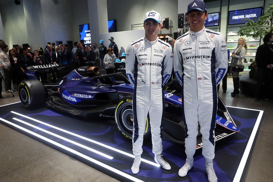 Williams Racing Formula One F1 drivers Alex Albon and Logan Sargeant pose for pictures next to the Williams FW46 car during an unveiling and launch event ahead of the 2024 F1 season in New York City, New York, U.S., February 5, 2024. REUTERS/Mike Segar