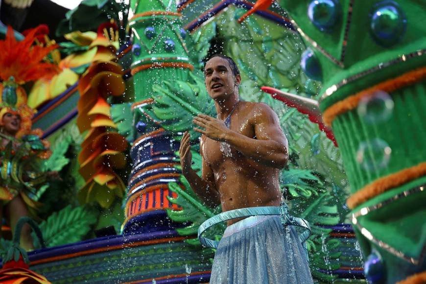 Revellers from Rosas de Ouro school perform during the first night of the Carnival parade at Anhembi Sambadrome in Sao Paulo, Brazil February 10, 2024. REUTERS/Carla Carniel