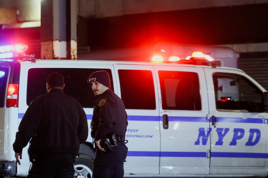 Members of the New York Police Department (NYPD) investigate the scene of a shooting at the Mount Eden subway station in the Bronx borough of New York City, U.S. February 12, 2024. REUTERS/Brendan McDermid