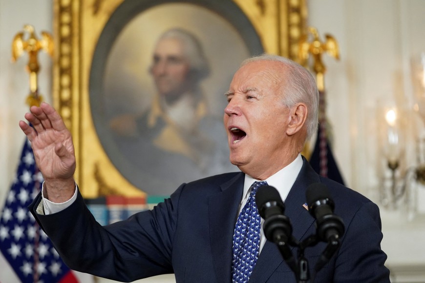 U.S. President Joe Biden reacts as he delivers remarks at the White House in Washington, U.S., February 8, 2024. REUTERS/Kevin Lamarque