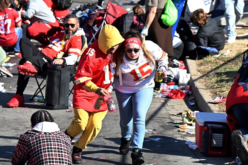 Feb 14, 2024; Kansas City, MO, USA; Fans leave the area after shots were fired after the celebration of the Kansas City Chiefs winning Super Bowl LVIII. Mandatory Credit: David Rainey-USA TODAY Sports     TPX IMAGES OF THE DAY