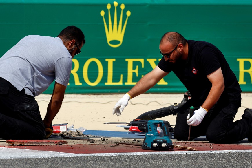 Formula One F1 - Pre-Season Testing - Bahrain International Circuit, Sakhir, Bahrain - February 23, 2024
Members of the Bahrain International Circuit emergency maintenance team prepare the race track REUTERS/Hamad I Mohammed