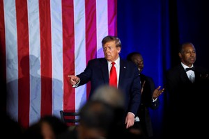 Republican presidential candidate and former U.S. President Donald Trump gestures while delivering a keynote speech at the Black Conservative Federation gala dinner, ahead of the South Carolina Republican presidential primary in Columbia, South Carolina, U.S., February 23, 2024. REUTERS/Alyssa Pointer