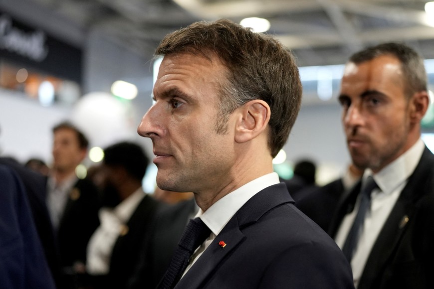 French President Emmanuel Macron listens to farmers as he visits the International Agriculture Fair during the opening day in Paris, Saturday, Feb. 24, 2024.     Lewis Joly/Pool via REUTERS