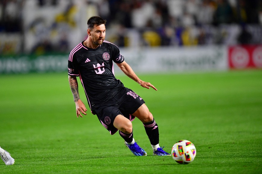 Feb 25, 2024; Carson, California, USA;  Inter Miami CF forward Lionel Messi (10) moves the ball against the LA Galaxy during the first half at Dignity Health Sports Park. Mandatory Credit: Gary A. Vasquez-USA TODAY Sports