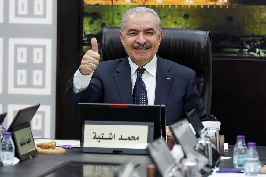 Palestinian Prime Minister Mohammad Shtayyeh gestures, as he convenes cabinet meeting, amid reports about Prime Minister Shtayyeh announcing his resignation, in Ramallah in the Israeli-occupied West Bank, February 26, 2024. REUTERS/Mohammed Torokman