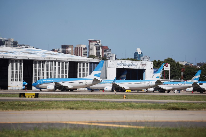Aerolineas Argentinas aeroplanes are parked at the Aeroparque Jorge Newbery airport, during a one-day national strike, in Buenos Aires, Argentina, January 24, 2024. REUTERS/Agustin Marcarian