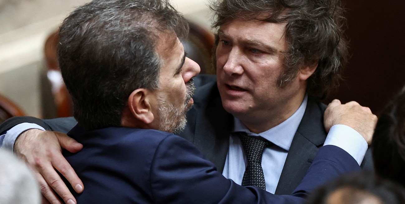 Argentine President-elect Javier Milei hugs lawmaker Cristian Ritondo, before the session of the legislative assembly at the National Congress, in Buenos Aires, Argentina, November 29, 2023. REUTERS/Agustin Marcarian
