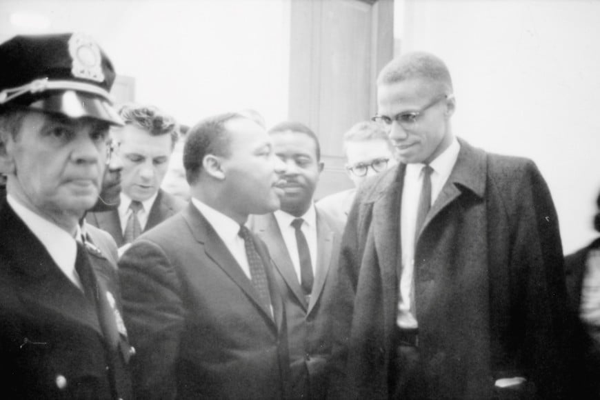FILE PHOTO: Martin Luther King Jr. and Malcolm X wait for a press conference to begin in an unknown location, March 26, 1964. Library of Congress/Marion S. Trikosko/Handout via REUTERS THIS IMAGE HAS BEEN SUPPLIED BY A THIRD PARTY. IT IS DISTRIBUTED, EXACTLY AS RECEIVED BY REUTERS, AS A SERVICE TO CLIENTS/File Photo