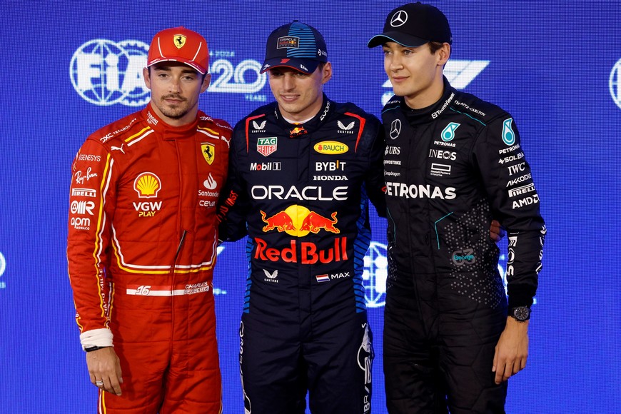 Formula One F1 - Bahrain Grand Prix - Bahrain International Circuit, Sakhir, Bahrain - March 1, 2024
Red Bull's Max Verstappen poses after qualifying in pole position alongside second placed Ferrari's Charles Leclerc and third placed Mercedes' George Russell REUTERS/Hamad I Mohammed