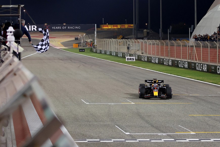 Formula One F1 - Bahrain Grand Prix - Bahrain International Circuit, Sakhir, Bahrain - March 2, 2024
Red Bull's Max Verstappen passes the chequered flag to win the Bahrain Grand Prix Pool via REUTERS/Ali Haider