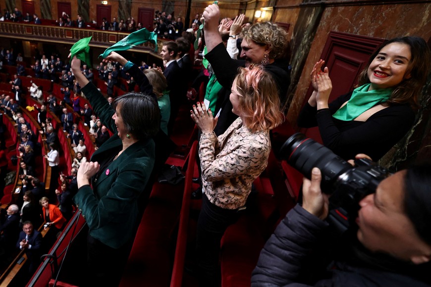 MPs and senators react after President of the National Assembly Yael Braun-Pivet announced the result of the vote during the convocation of a congress of both houses of parliament in Versailles, southwestern of Paris, France March 4, 2024, to anchor the right to abortion in the country's constitution. EMMANUEL DUNAND/Pool via REUTERS