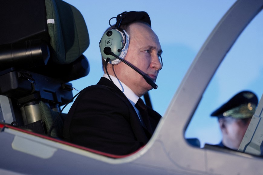 Russian President Vladimir Putin sits in a cockpit of a flight simulator at the Higher Military Aviation School of Pilots named after Hero of the Soviet Union A.K. Serov in Krasnodar, Russia March 7, 2024. Sputnik/Mikhail Metzel/Pool via REUTERS ATTENTION EDITORS - THIS IMAGE WAS PROVIDED BY A THIRD PARTY.