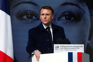 French President Emmanuel Macron speaks during a ceremony to seal the right to abortion in the French constitution, on International Women's Day, at the Place Vendome, in Paris, France March 8, 2024. REUTERS/Gonzalo Fuentes/Pool