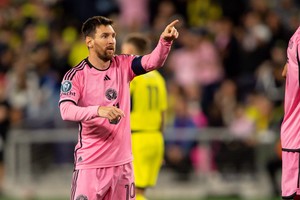 Mar 7, 2024; Nashville, TN, USA; Inter Miami forward Lionel Messi (10) points to his teammates after his goal against the Nashville SC during the second half at GEODIS Park. Mandatory Credit: Steve Roberts-USA TODAY Sports