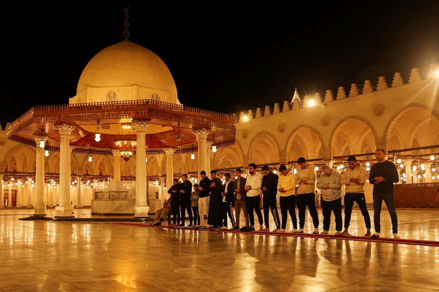 Muslim worshippers take part in evening prayers called "Tarawih" during the eve of the first night of the Muslim holy fasting month of Ramadan, at Amr Ibn El-Aas mosque, the first and oldest mosque ever built on the land of Egypt in old Cairo, Egypt March 10, 2024. REUTERS/Amr Abdallah Dalsh