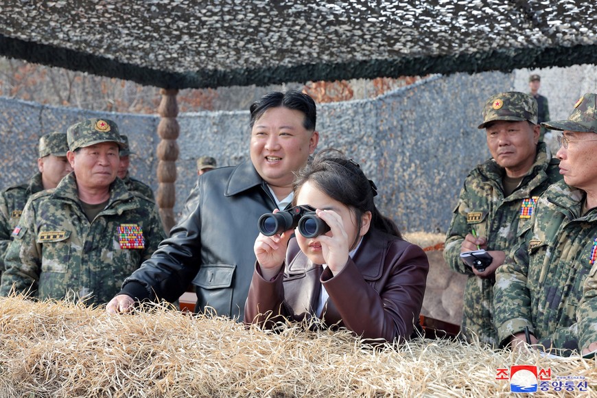 North Korean leader Kim Jong Un and his daughter Kim Ju Ae attend a military demonstration in North Korea, in this picture released on March 16, 2024 by the Korean Central News Agency. KCNA via REUTERS    ATTENTION EDITORS - THIS IMAGE WAS PROVIDED BY A THIRD PARTY. REUTERS IS UNABLE TO INDEPENDENTLY VERIFY THIS IMAGE. NO THIRD PARTY SALES. SOUTH KOREA OUT. NO COMMERCIAL OR EDITORIAL SALES IN SOUTH KOREA.