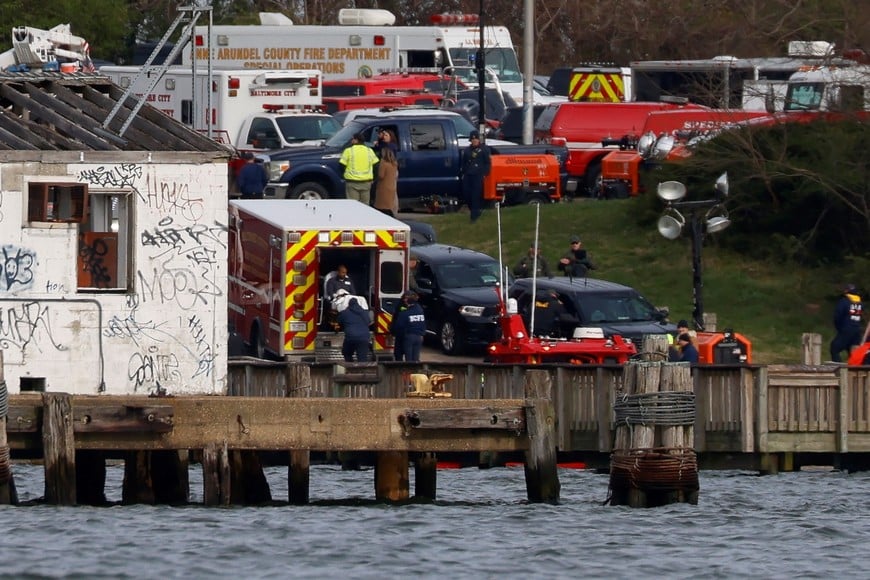 An injured sailor from Dali cargo vessel is loaded into an ambulance, after getting taken off the ship, following Francis Scott Key Bridge collapse, in Baltimore, Maryland, U.S., March 26, 2024.  REUTERS/Julia Nikhinson