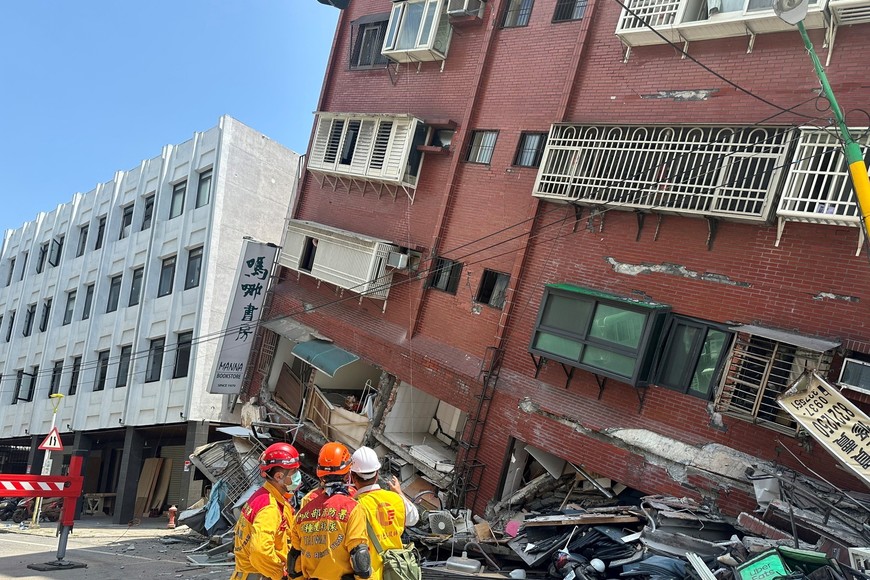 Firefighters work at the site where a building collapsed following the earthquake, in Hualien, Taiwan, in this handout provided by Taiwan's National Fire Agency on April 3, 2024. Taiwan National Fire Agency/Handout via REUTERS  ATTENTION EDITORS - THIS IMAGE WAS PROVIDED BY A THIRD PARTY. NO RESALES. NO ARCHIVES.