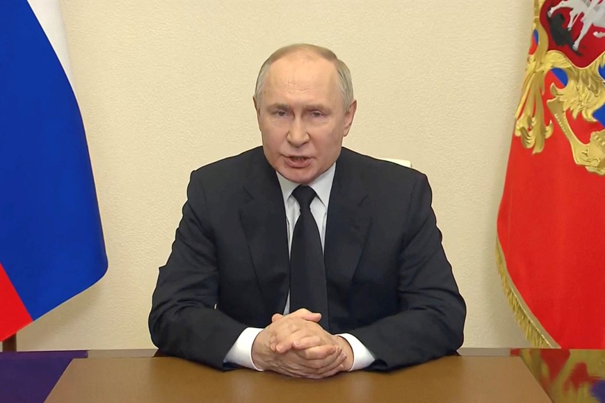 Russian President Vladimir Putin delivers a video address to the nation following a shooting attack at the Crocus City Hall concert venue, at an unidentified location, March 23, 2024, in this still image taken from video. Kremlin.ru/Handout via REUTERS ATTENTION EDITORS - THIS IMAGE WAS PROVIDED BY A THIRD PARTY. MANDATORY CREDIT.