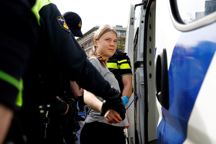 Swedish climate campaigner Greta Thunberg is detained by police, on the day climate activists try to block the A12 highway to ensure that the Dutch government stops subsidies for fossil fuels, in The Hague, Netherlands, April 6, 2024. REUTERS/Piroschka van de Wouw