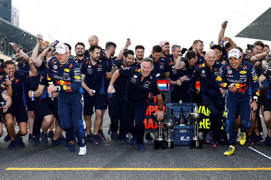 Formula One F1 - Japanese Grand Prix - Suzuka Circuit, Suzuka, Japan - April 7, 2024
Red Bull's Max Verstappen celebrates with team principal Christian Horner and second place Red Bull's Sergio Perez with teammates after winning the Japanese Grand Prix REUTERS/Issei Kato