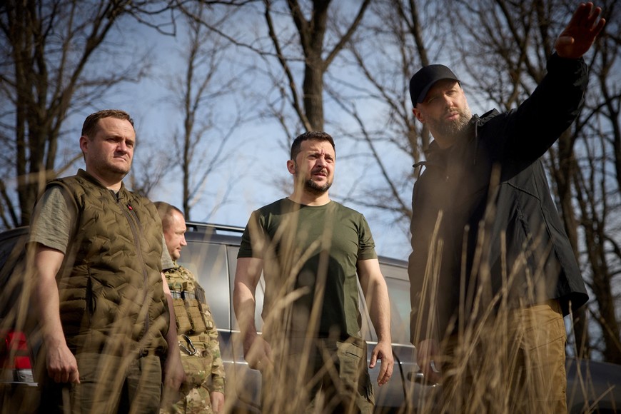 Ukraine's President Volodymyr Zelenskiy and Head of Kharkiv Regional-Military Administration Oleh Syniehubov inspect new fortifications for Ukrainian servicemen, amid Russia's attack on Ukraine, near Russian border in Kharkiv region, Ukraine, April 9, 2024. Ukrainian Presidential Press Service/Handout via REUTERS ATTENTION EDITORS - THIS IMAGE HAS BEEN SUPPLIED BY A THIRD PARTY.
