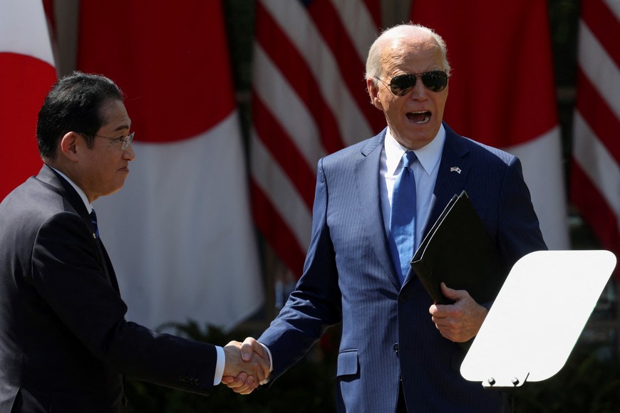 U.S. President Joe Biden shakes hands with Japanese Prime Minister Fumio Kishida following a joint press conference in the Rose Garden at the White House in Washington, D.C., U.S., April 10, 2024. REUTERS/Tom Brenner