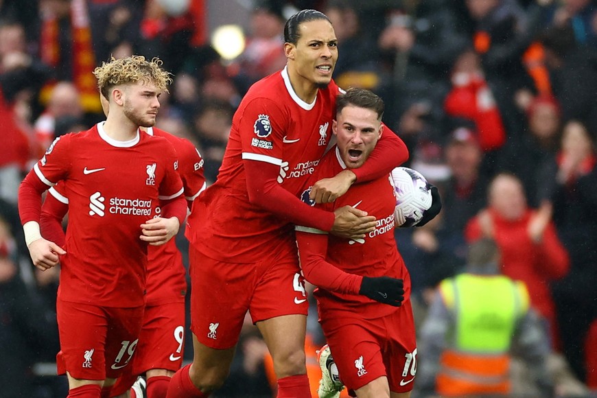 Soccer Football - Premier League - Liverpool v Manchester City - Anfield, Liverpool, Britain - March 10, 2024
Liverpool's Alexis Mac Allister celebrates scoring their first goal with Virgil van Dijk REUTERS/Carl Recine NO USE WITH UNAUTHORIZED AUDIO, VIDEO, DATA, FIXTURE LISTS, CLUB/LEAGUE LOGOS OR 'LIVE' SERVICES. ONLINE IN-MATCH USE LIMITED TO 45 IMAGES, NO VIDEO EMULATION. NO USE IN BETTING, GAMES OR SINGLE CLUB/LEAGUE/PLAYER PUBLICATIONS.